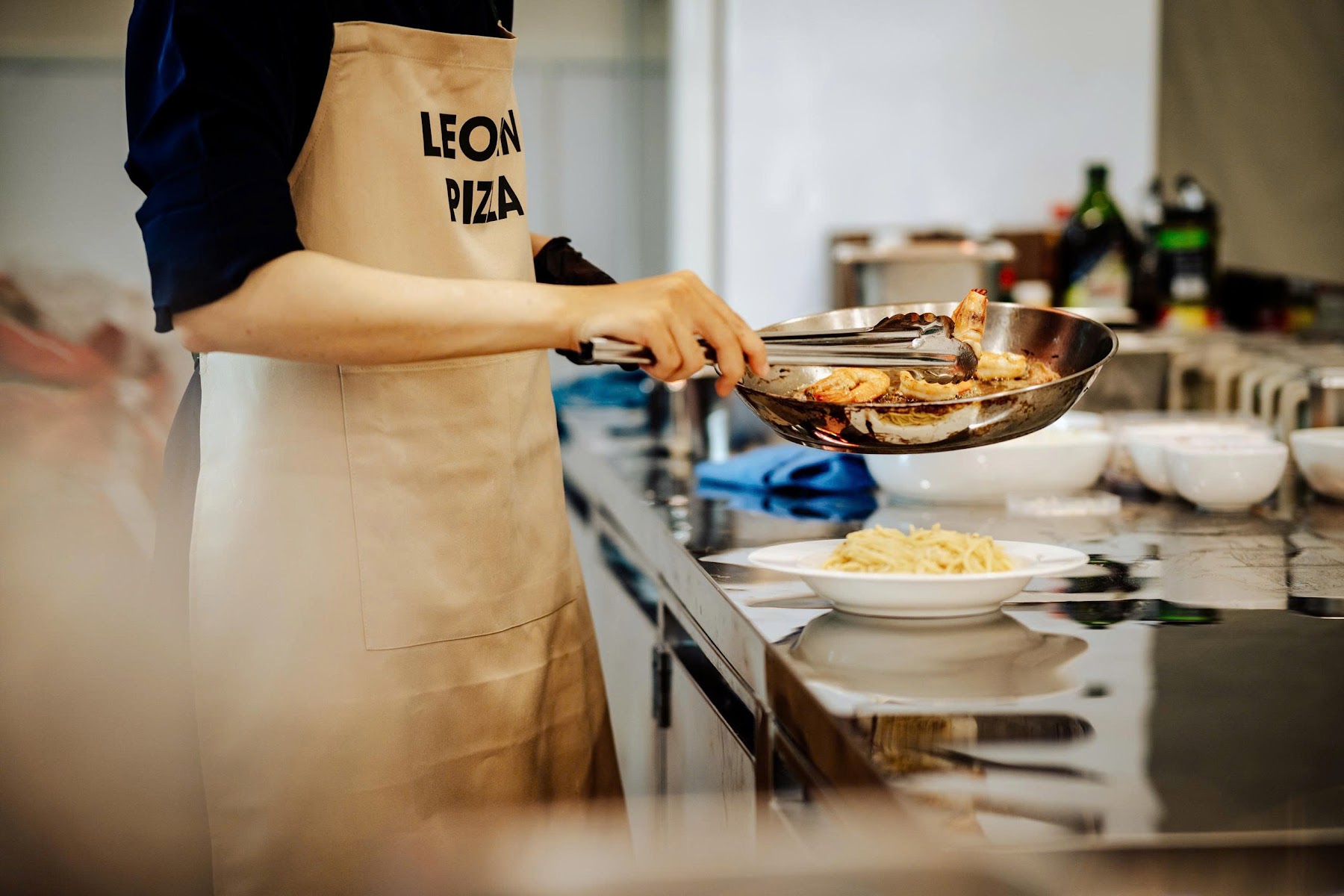 LeoLen Pizza team preparing food in the open kitchen